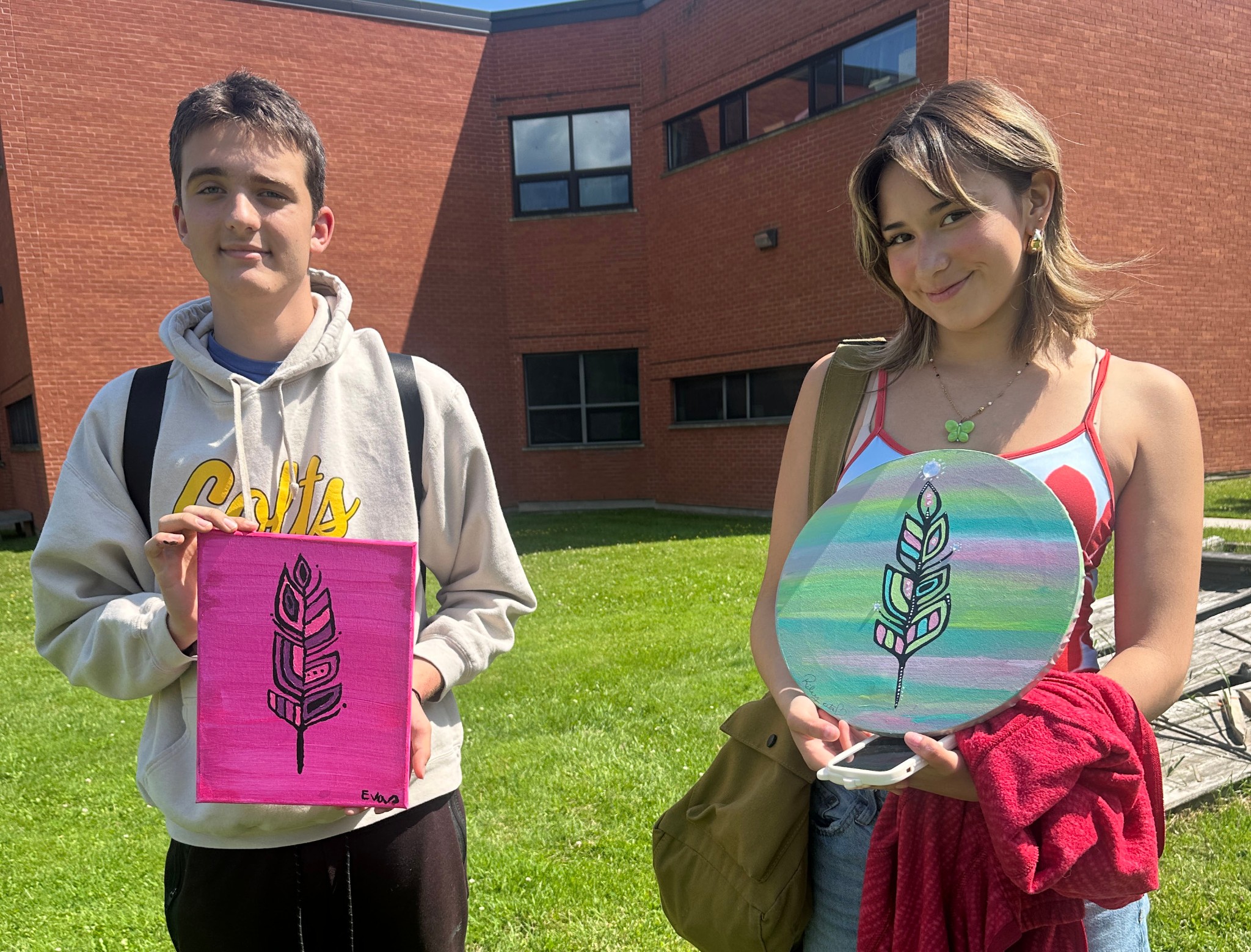 HomePage Photo students show artwork outsideCROP